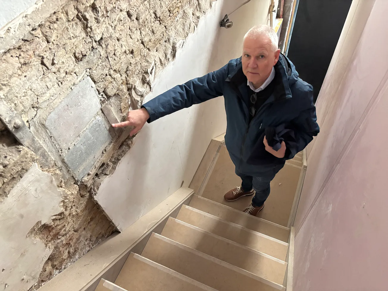 Weggezaagde balk houdt bouw 4 woningen boven winkel tegen